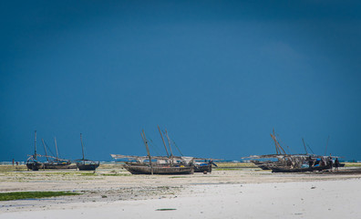 Fototapeta na wymiar Boats Beached Land Island Relax Sky Blue Background