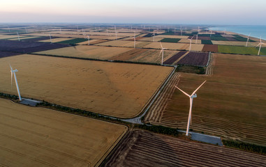 Beautiful landscape with windmills on the field. Birds eye view