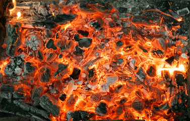 Burning coals texture of bonfire abstract background.