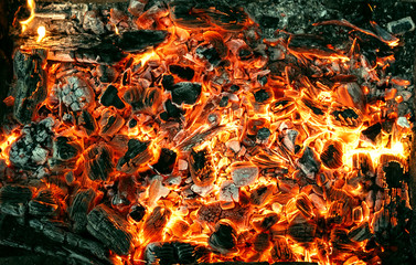 Burning coals texture of bonfire abstract background.