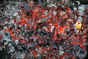 Burning coals texture of bonfire abstract background.
