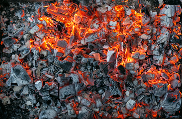 Burning coals texture of bonfire abstract background.