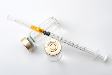 Vaccines, botulinum toxin and insulin ampules concept theme with glass vials with clear liquid next...