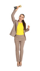 Full length portrait of excited young businesswoman with gold trophy cup on white background