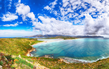 Fantastic view on Lagoon of Porto Giunco with turquoise water and old tower
