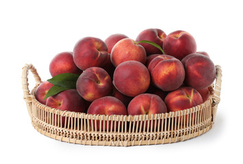 Tray of delicious ripe peaches isolated on white