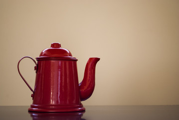 red coffee pot on the table
