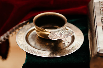 Glass of red wine for a ceremony in orthodox church