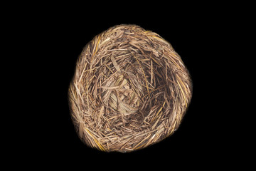 Empty bird nest isolated on black background