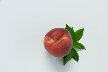 One Peach with Leaf Stem on White Background, Isolated Peach, Copy Space