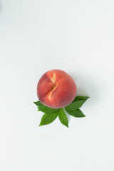 One Peach with Leaf Stem on White Background, Isolated Peach, Copy Space