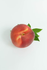 One Peach with Leaf Stem on White Background, Isolated Peach, Copy Space