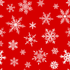 Fototapeta na wymiar Christmas seamless pattern of complex big and small snowflakes in white colors on red background