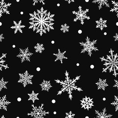 Naklejka na ściany i meble Christmas seamless pattern of complex big and small snowflakes in white colors on black background
