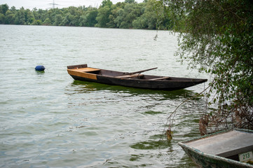 Moored, old rowboat on a lake