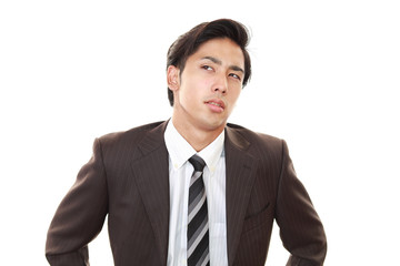 疲れた表情のビジネスマン