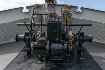 Windlass or capstan at the bow of a historical sailing ship