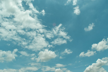 blue sky background with tiny clouds.