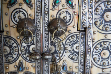 Detail vintage middle east beautiful key holder. Door knob background. Copyspace.