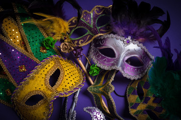 Mardi Gras masks on a dark background