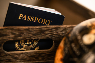 passport peaking out of a box