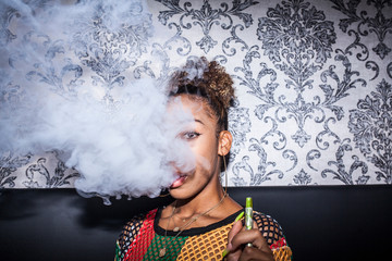 Afro woman smoking
