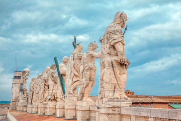 Fototapeta na wymiar Apostles sculptures of St. Peter basilica in Vatican