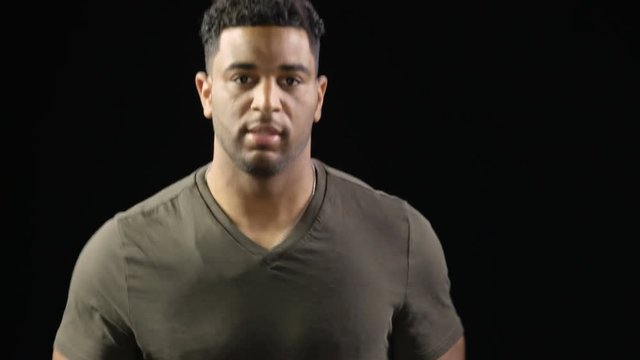 Head and shoulders shot of a man running on a treadmill