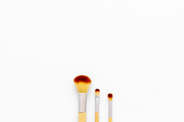 Instruments for make up with brushes on white background top view mock up