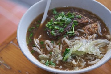Taiwanese food of soup noodles with pork ribs cakes at restaurant