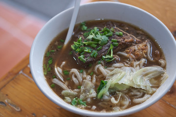 Taiwanese food of soup noodles with pork ribs cakes at restaurant