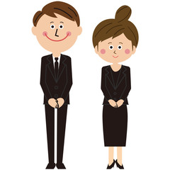 ポップな黒いスーツを着た男女がお出迎え