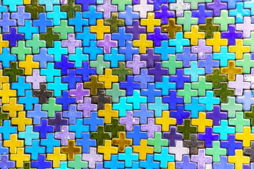 Multicolored plus shaped of ceramic wall tile decorated as the abstract material background and...