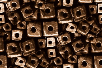 Dark brown decorated cubes brick wall pattern with hole design as the abstract textured and...