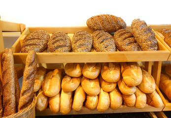 Fresh pastries, rolls and baguettes for Breakfast from different flours with different toppings 