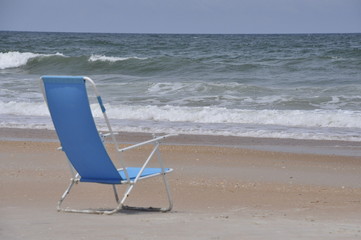 Fototapeta na wymiar blue chair on beach