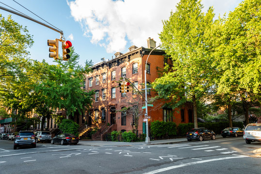 Clinton Hill, Brooklyn, United States - June 30, 2019: Historic brownstone building on beautiful summer evening in Clinton Hill, Brooklyn, New York. - Powered by Adobe