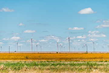 Wind turbine farm generator near Roscoe or Sweetwater Texas in USA in prairie with rows of many...