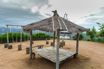 Fototapeta na wymiar Bamboo hut, grass roof Sky background image