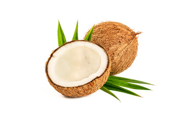 Coconut with green leaves isolated on white