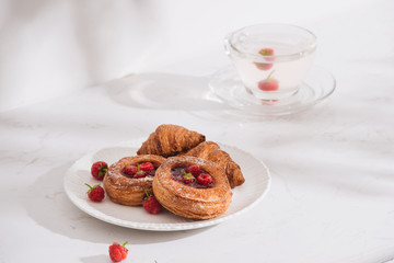 Raspberry filled pastries with sugar sprinkles. Selective focus.
