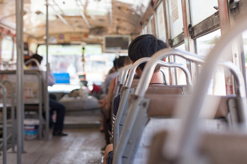 Naklejka na ściany i meble Passengers and Empty seats on the bus