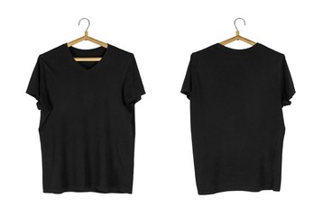 A black t-shirt hangs on a wooden hanger. Close up. Isolated on white background.
