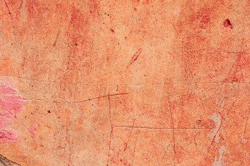 Texture of a concrete wall with cracks and scratches which can be used as a background