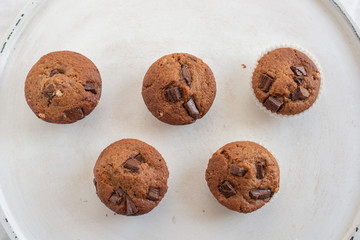 home made chocolate chip muffins in a muffin tray