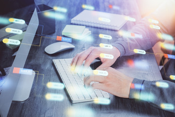 Double exposure of technology hologram with man working on computer background. Concept of big data.