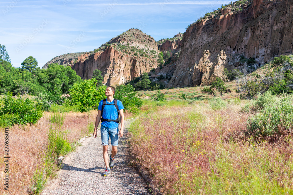 Wall mural main loop path trail with man walking in bandelier national monument in new mexico in los alamos wit