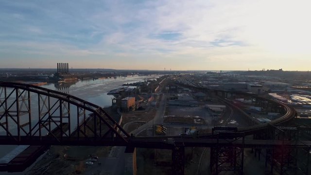 Aerial view of the Mississippi river, MacArthur Bridge, and the Mural Mile in St. Louis Missouri.