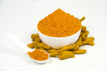 Turmeric powder isolated on a white background