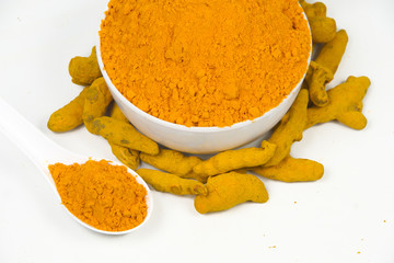 Turmeric powder isolated on a white background